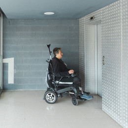 Senior Man with Disability Waiting for Elevator