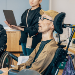Happy woman in wheelchair using phone