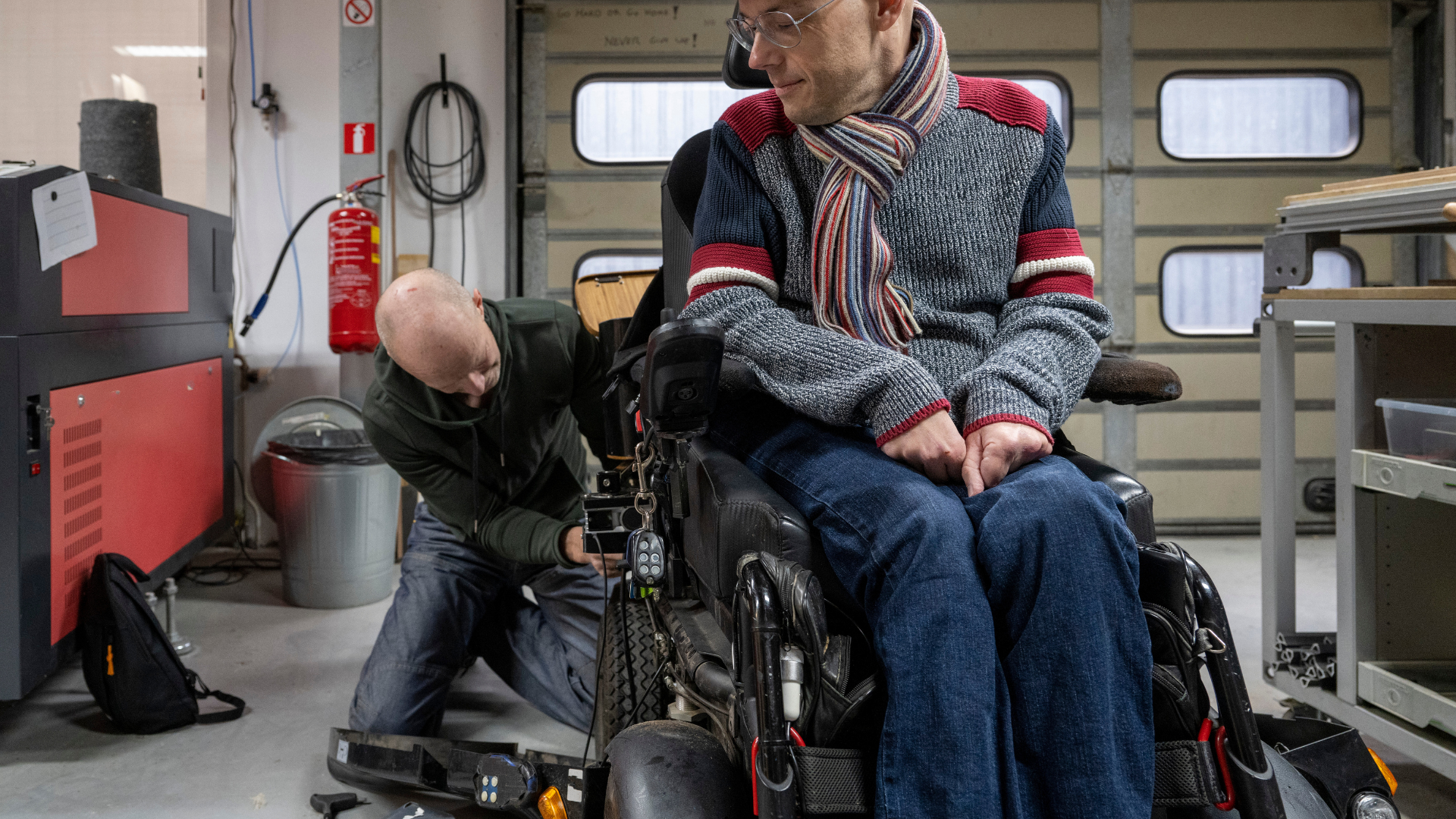 Assistive technology professional working on wheelchair