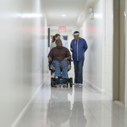 Ambulatory Wheelchair User in Hallway