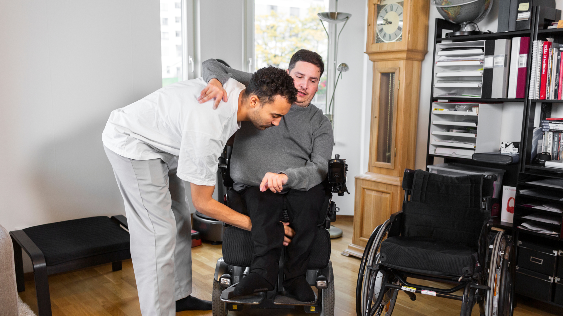 Aid Helping with a Wheelchair Transfer