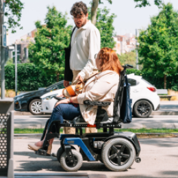 Woman in Wheelchair Talking with Friend