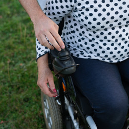 Man Helping Woman With Wheelchair