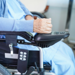 Wheelchair with hand on controller