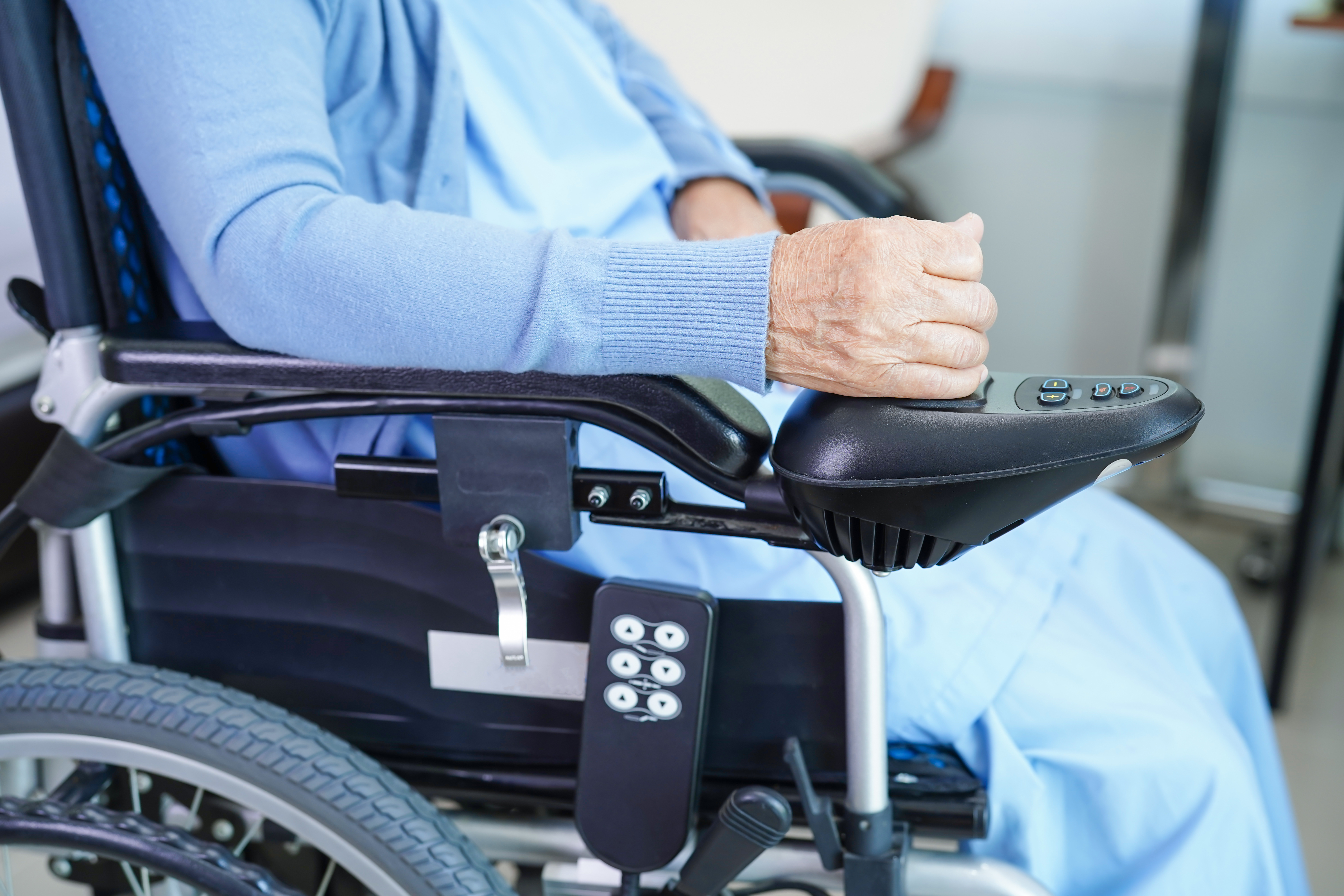 Wheelchair with hand on controller