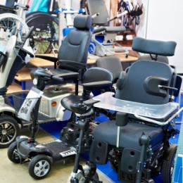 Power wheelchairs parked in a row. 