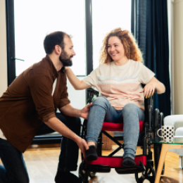 Home health aide helping patient in wheelchair