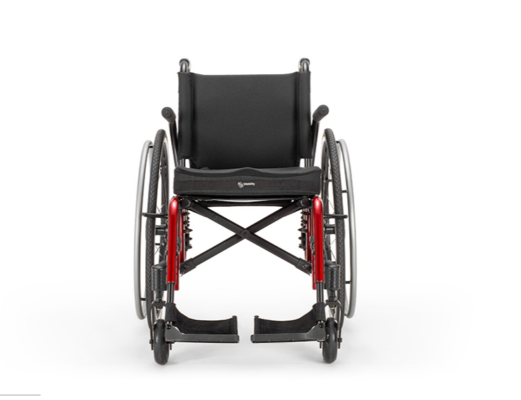 Clear front view of the Catalyst 5 manual wheelchair, with a black seat and footrests.